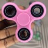 pink plastic fidget spinner from rubeecharms