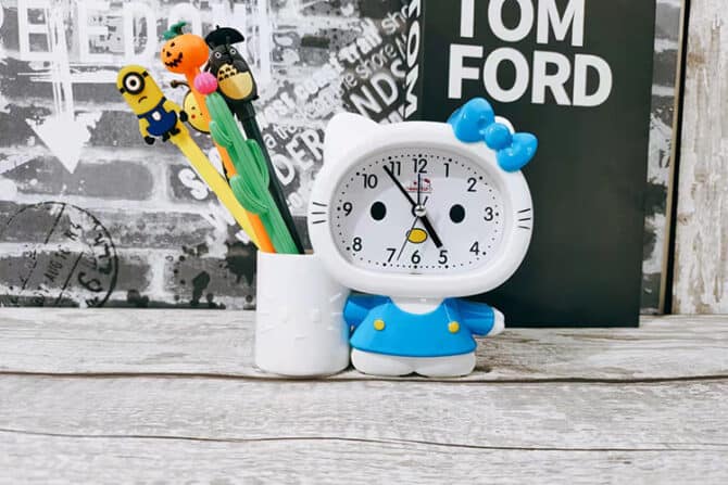 blue alarm clock pen holder