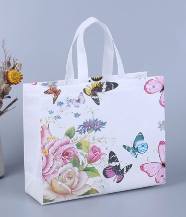 blue and pink butterflies on a white gift shopping bag