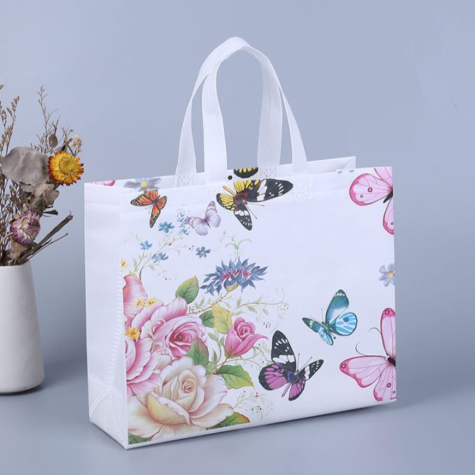 blue and pink butterflies on a white gift shopping bag