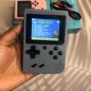 grey handheld retro game console with 500 classic games