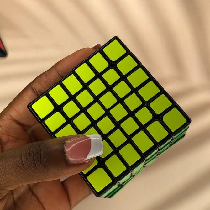 yellow side of a 6x6x6 speed cube by Rubeecharms Nigeria